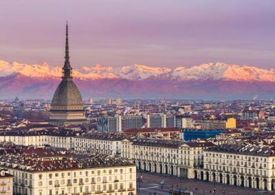 AQTO Cycling Turin with the Alps in the background