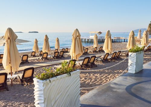 scenic view private sandy beach with sun beds parasokamy sea mountains resort